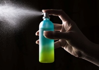 Fragrance being sprayed, illustrating how common products can affect those with sensitivities.